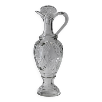 Vintage pressed glass carafe from the 1960s, clear sculptural glass with textured patterns and a stopper.