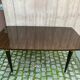 Scandinavian extendable dining table made of solid wood and rosewood effect.