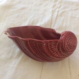 Empty red ceramic snail shaped pouch