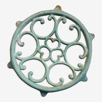 Old cast iron trivety turquoise