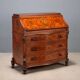 Antique drop-leaf table in walnut with maple inlays, Italy, 20th century.