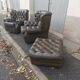 Pair of Chesterfield armchairs with footrest