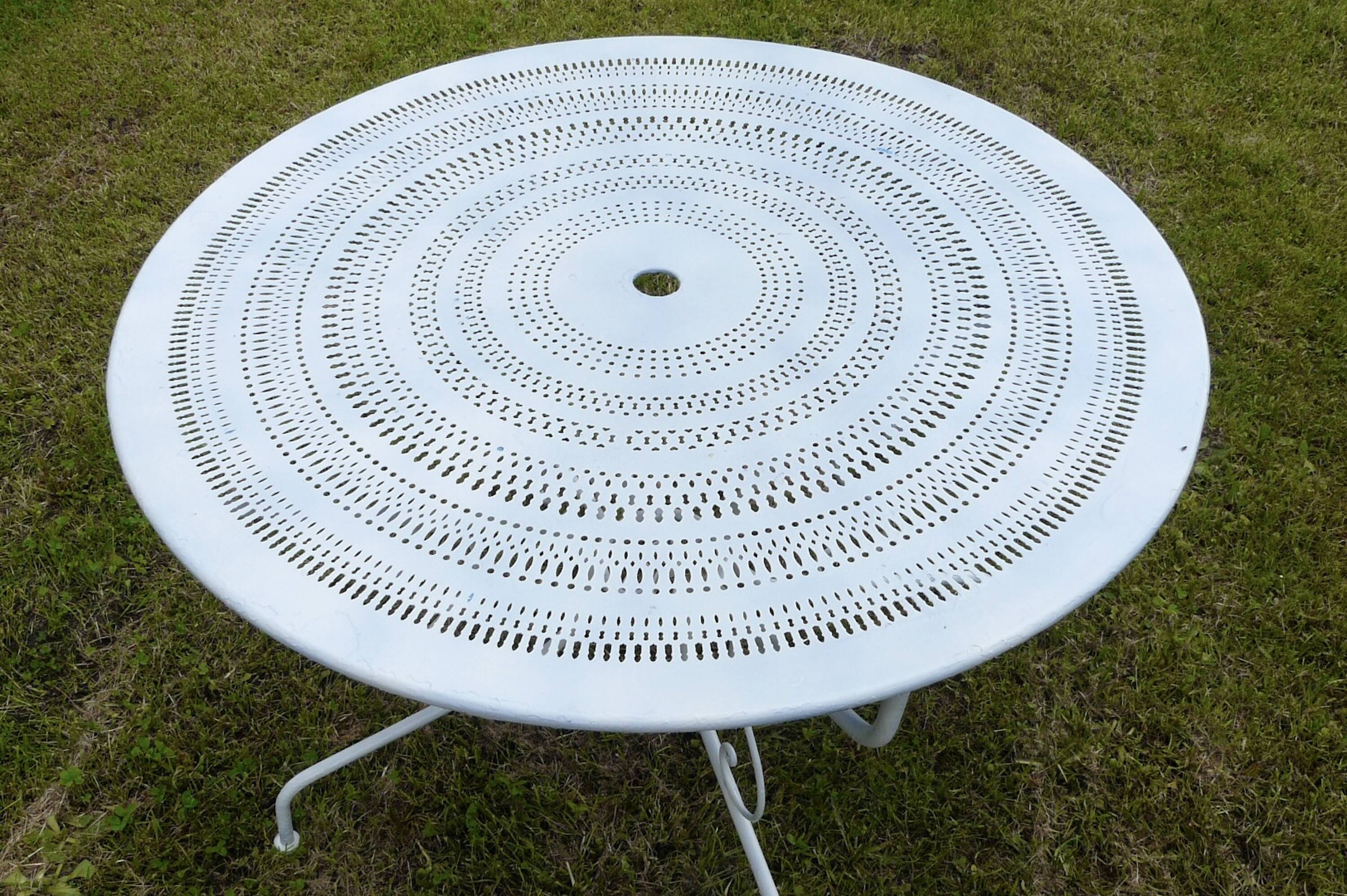 Round wrought iron garden table from the 1900s