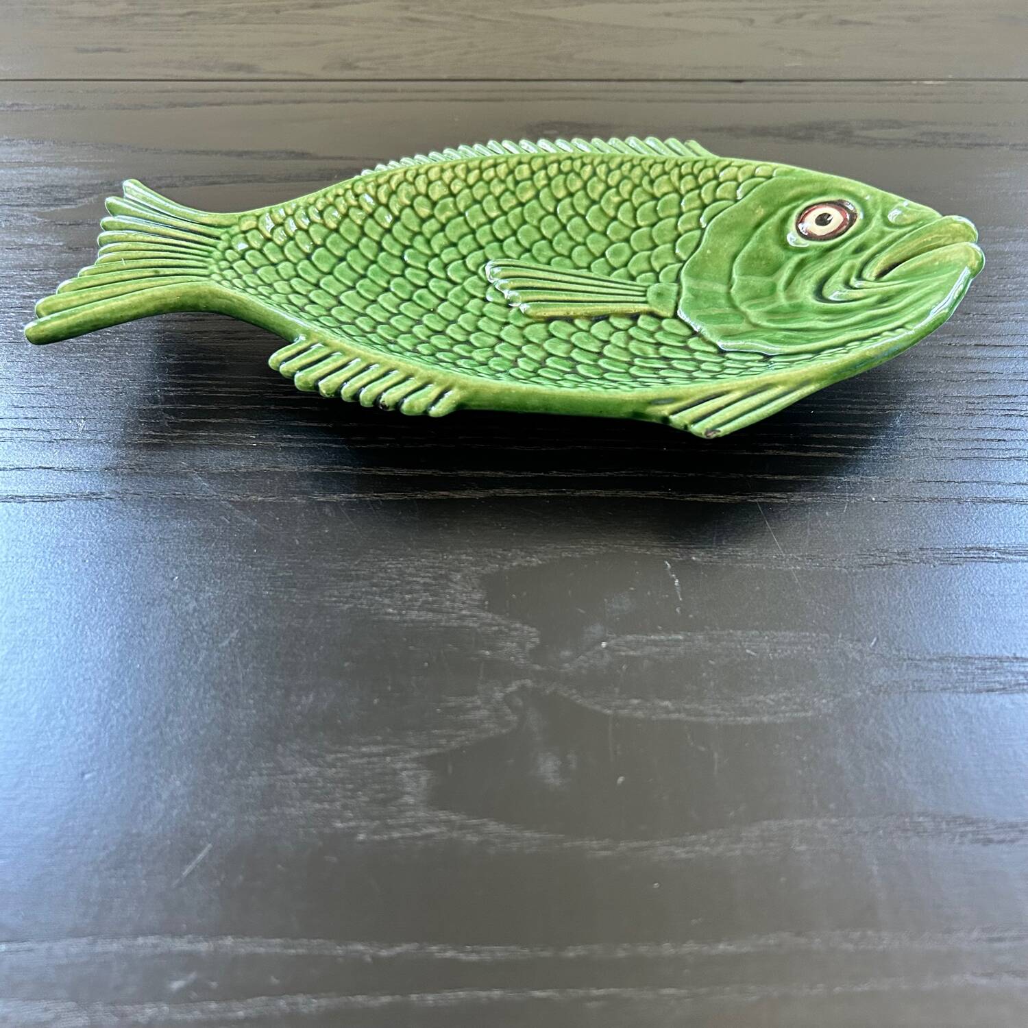 Fish dish in green earthenware