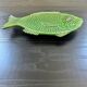 Fish dish in green earthenware