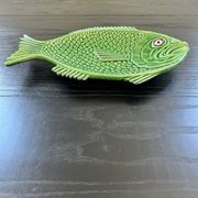 Fish dish in green earthenware