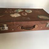 Suitcase of leather with labels of palaces