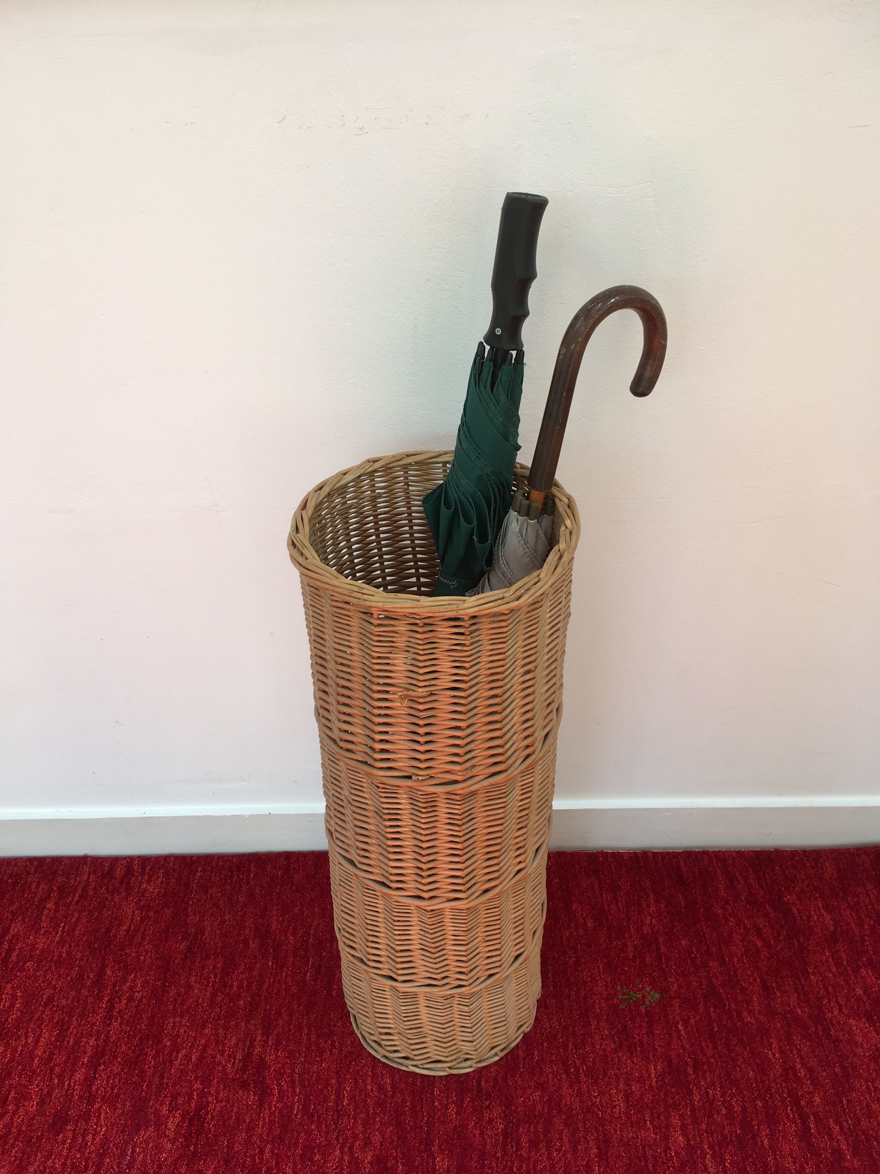 Vintage umbrella holder in wicker rattan