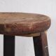 Antique round dark colored stool (c.1900)