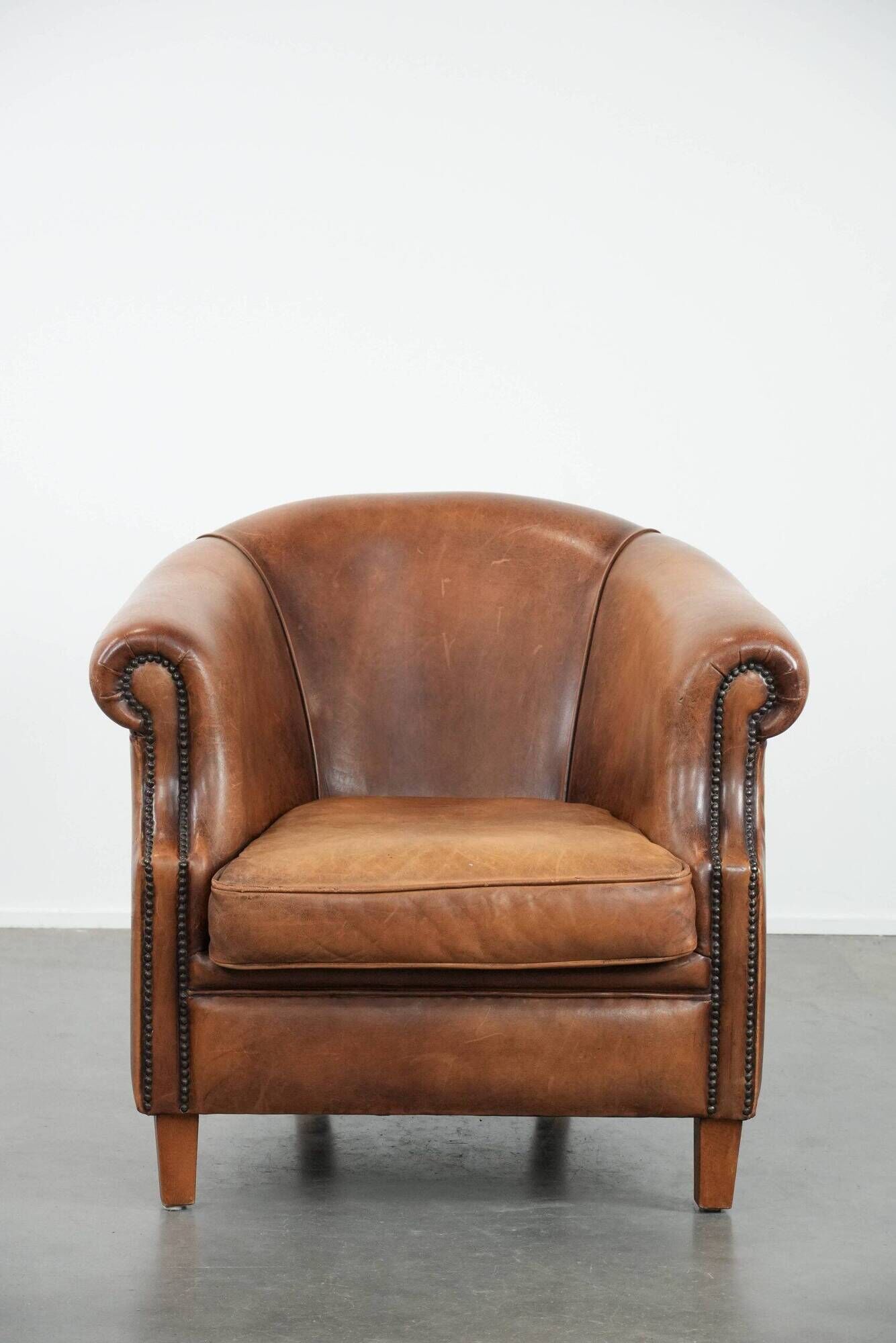 Comfortable club chair made of sheepskin leather
