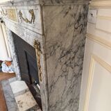 Louis XVI fireplace in veined grey marble with original gilded bronzes from the 19th century.