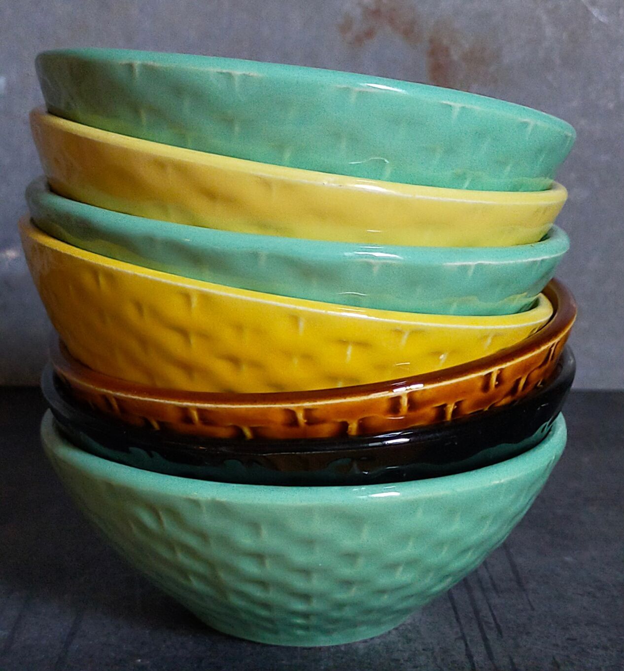 Seven vintage slip ceramic bowls