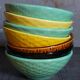 Seven vintage slip ceramic bowls