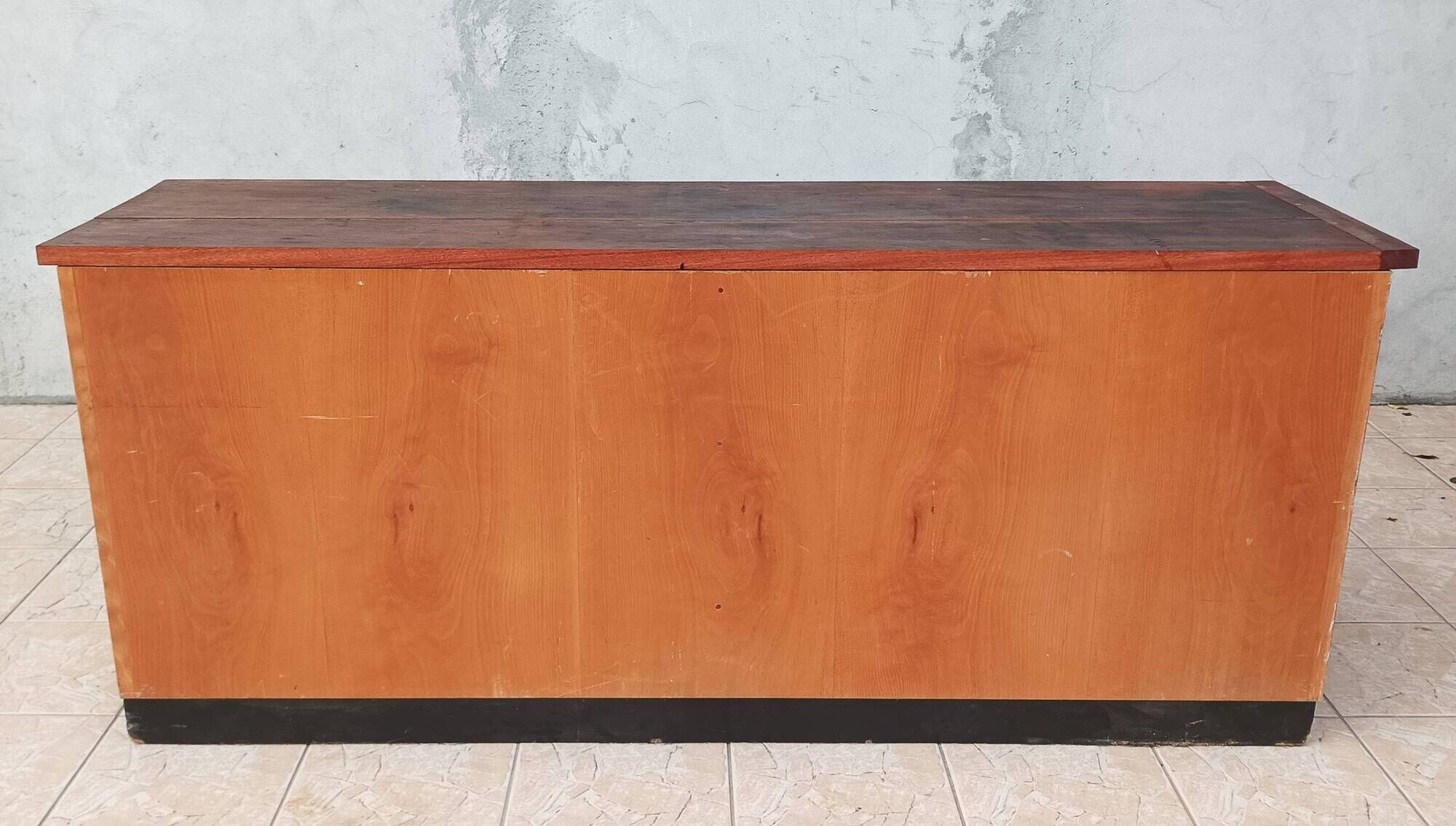 Workshop furniture with drawers and curtain in beech and walnut.