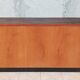 Workshop furniture with drawers and curtain in beech and walnut.