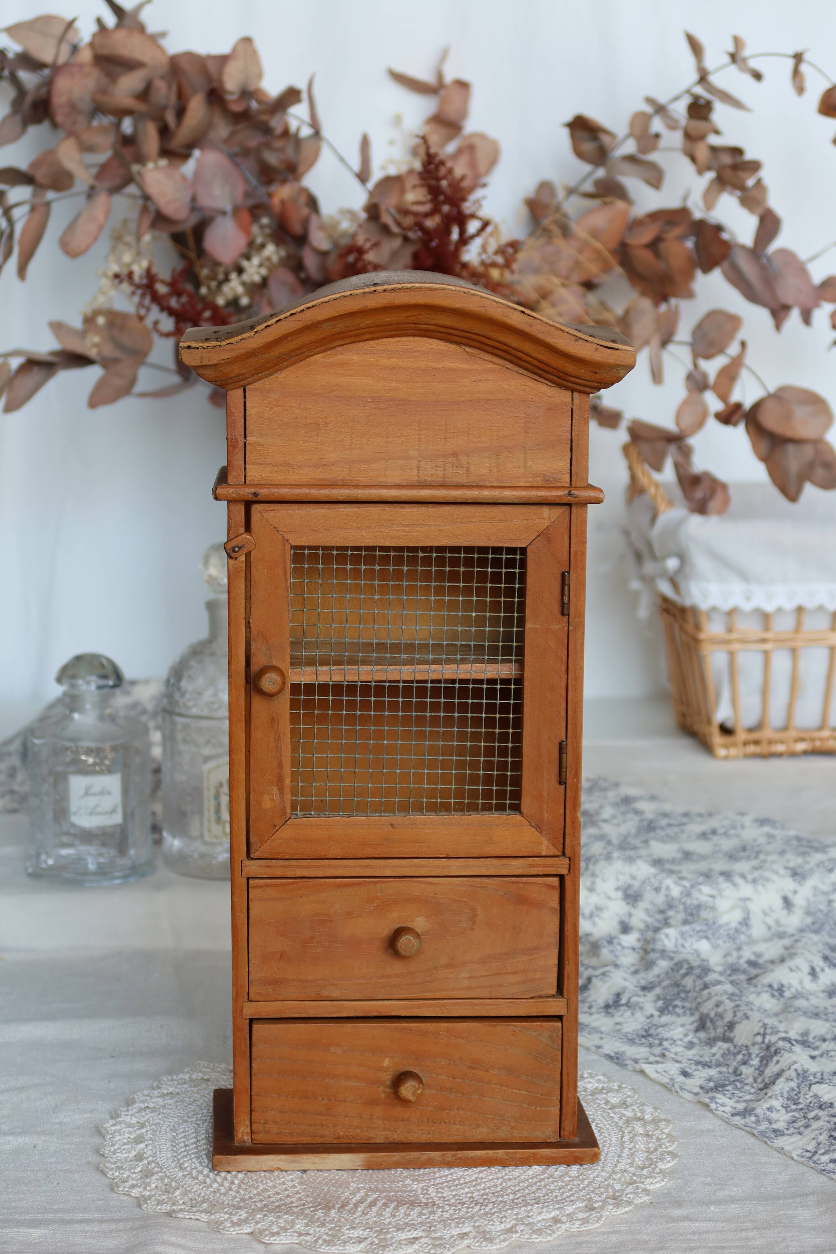 Vintage wooden shelf with drawers and wire mesh door