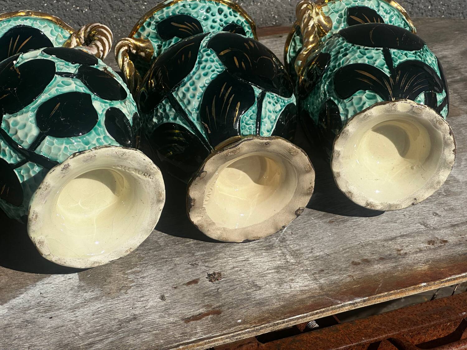 Trio of Vallauris vases in turquoise and black, highlighted with gold, 22 cm high