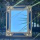 Baroque mirror in gilded wood on a black background.