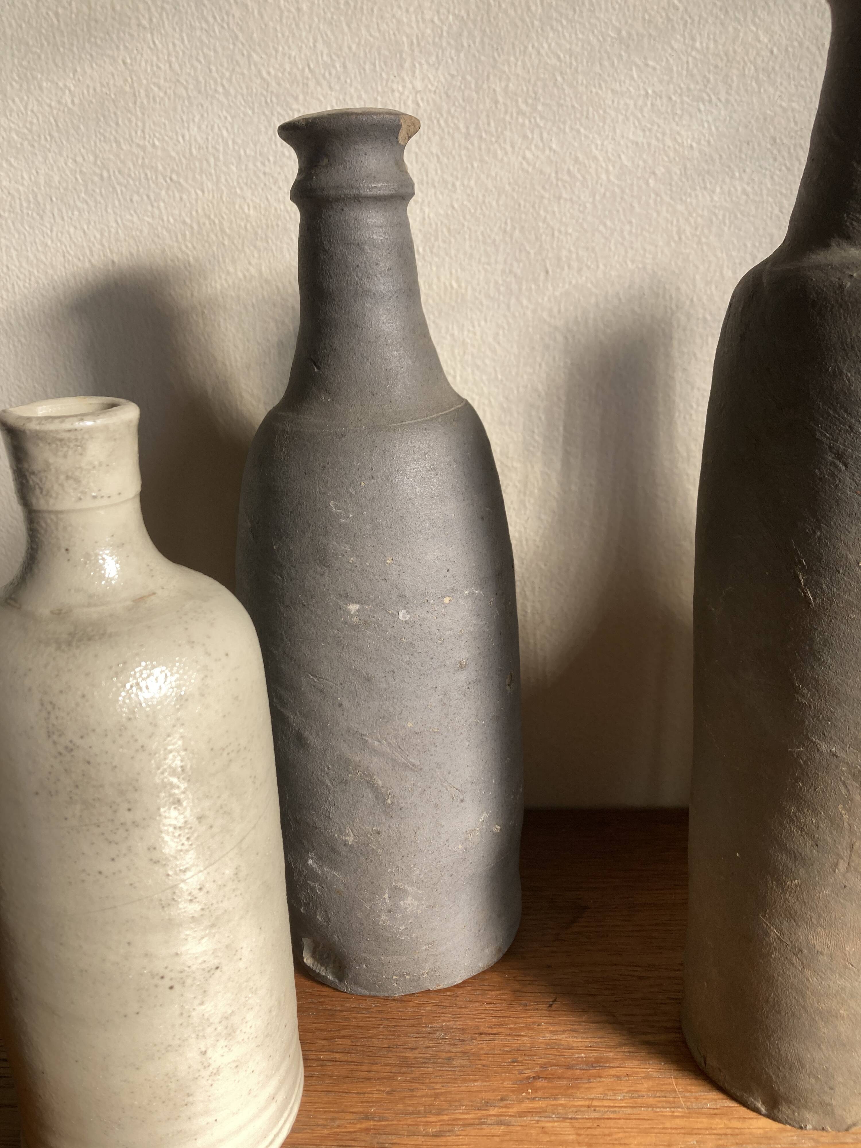 Set de 6 bouteilles de grès et terre cuite 1900-1930