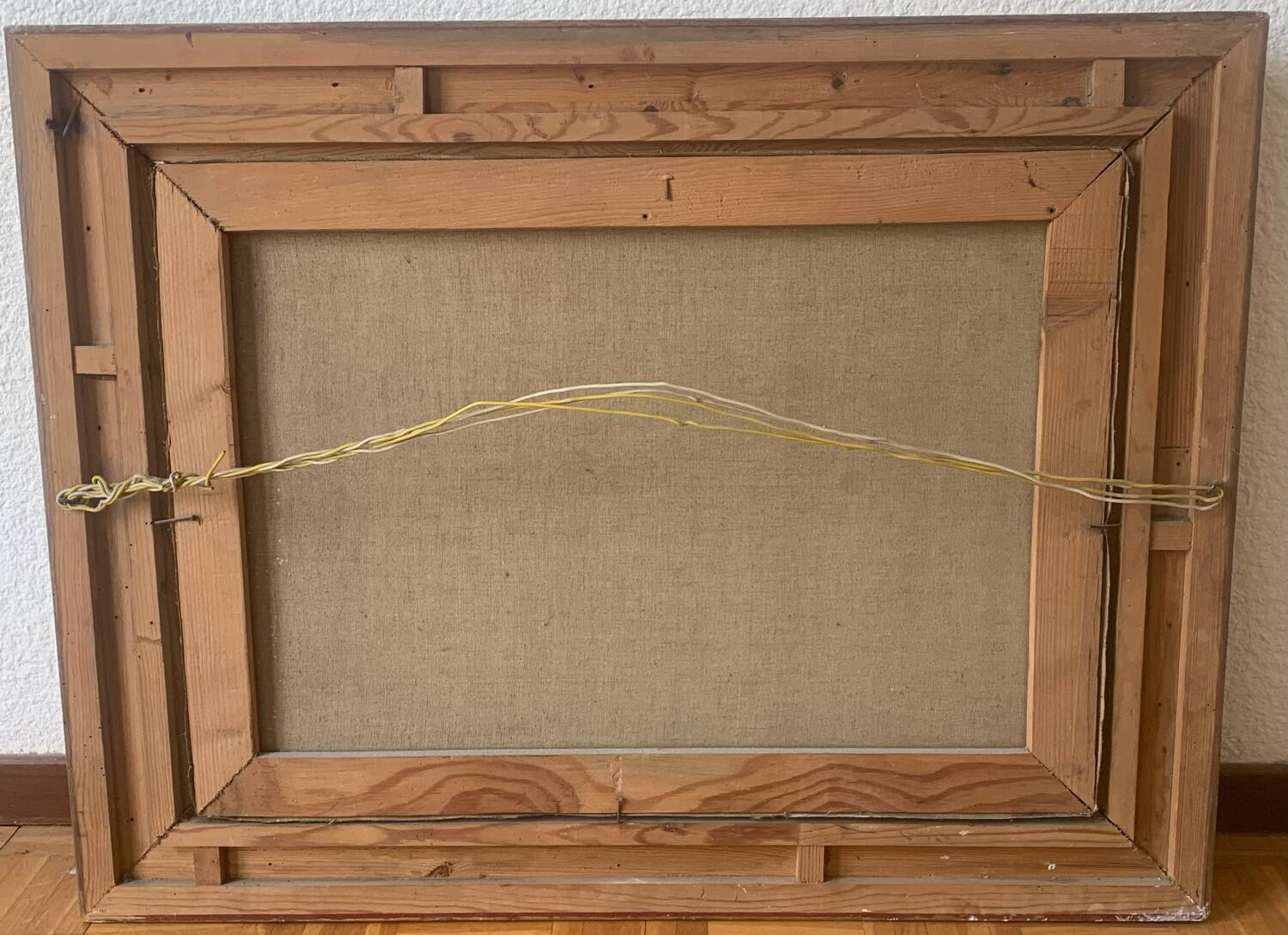 Large painting of a house by the water