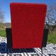 Vintage armchairs in red and black faux leather, the pair.