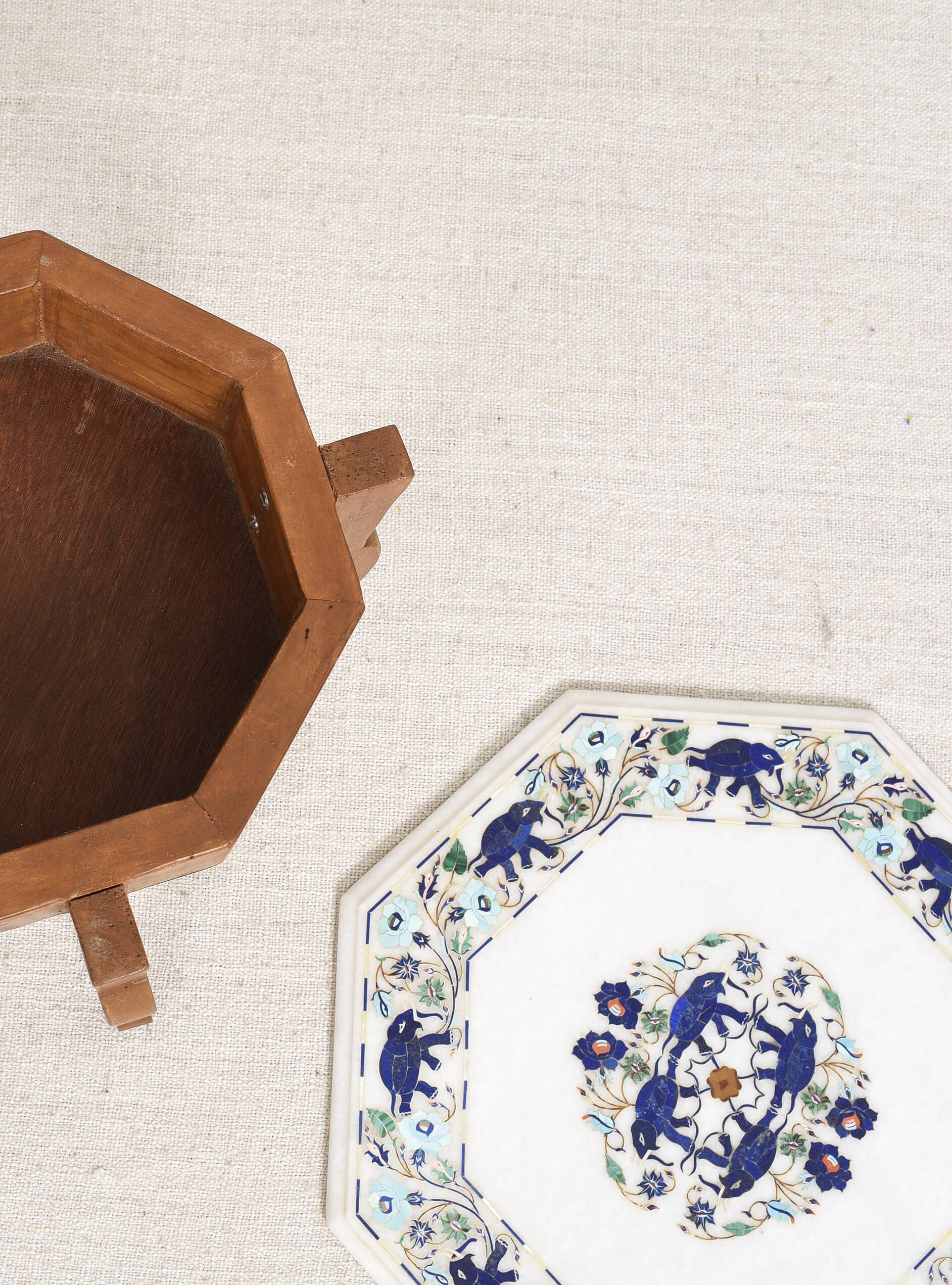 Side table with marble top and inlaid stones