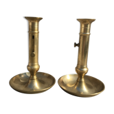 Pair of old brass pusher candle holders