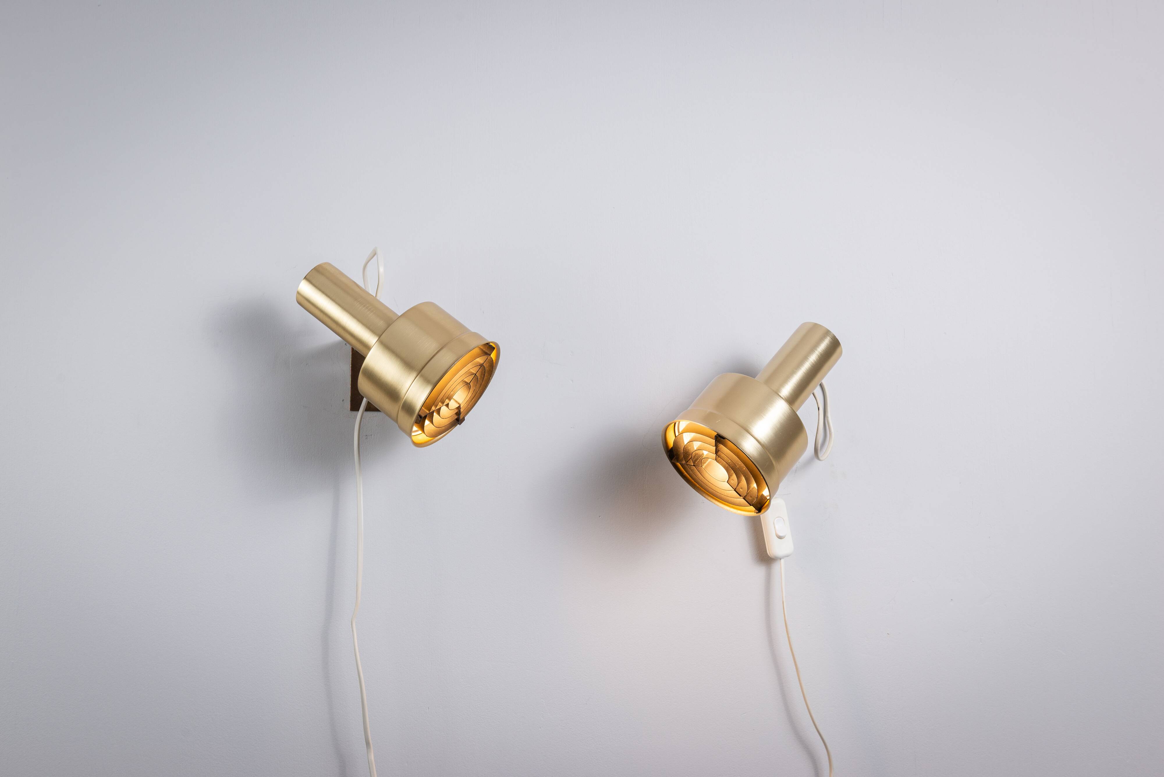 Pair of adjustable wall lamps designed by Per Sundstedt for Kosta Lampan
