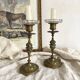 Pair of openwork brass candlesticks and glass bobeches