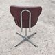 Set of 4 Mid Century Modern swivel chairs in tubular steel and leather.