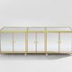 Brass sideboard with mirror and plexiglass legs by Michel Pigneres, 1970