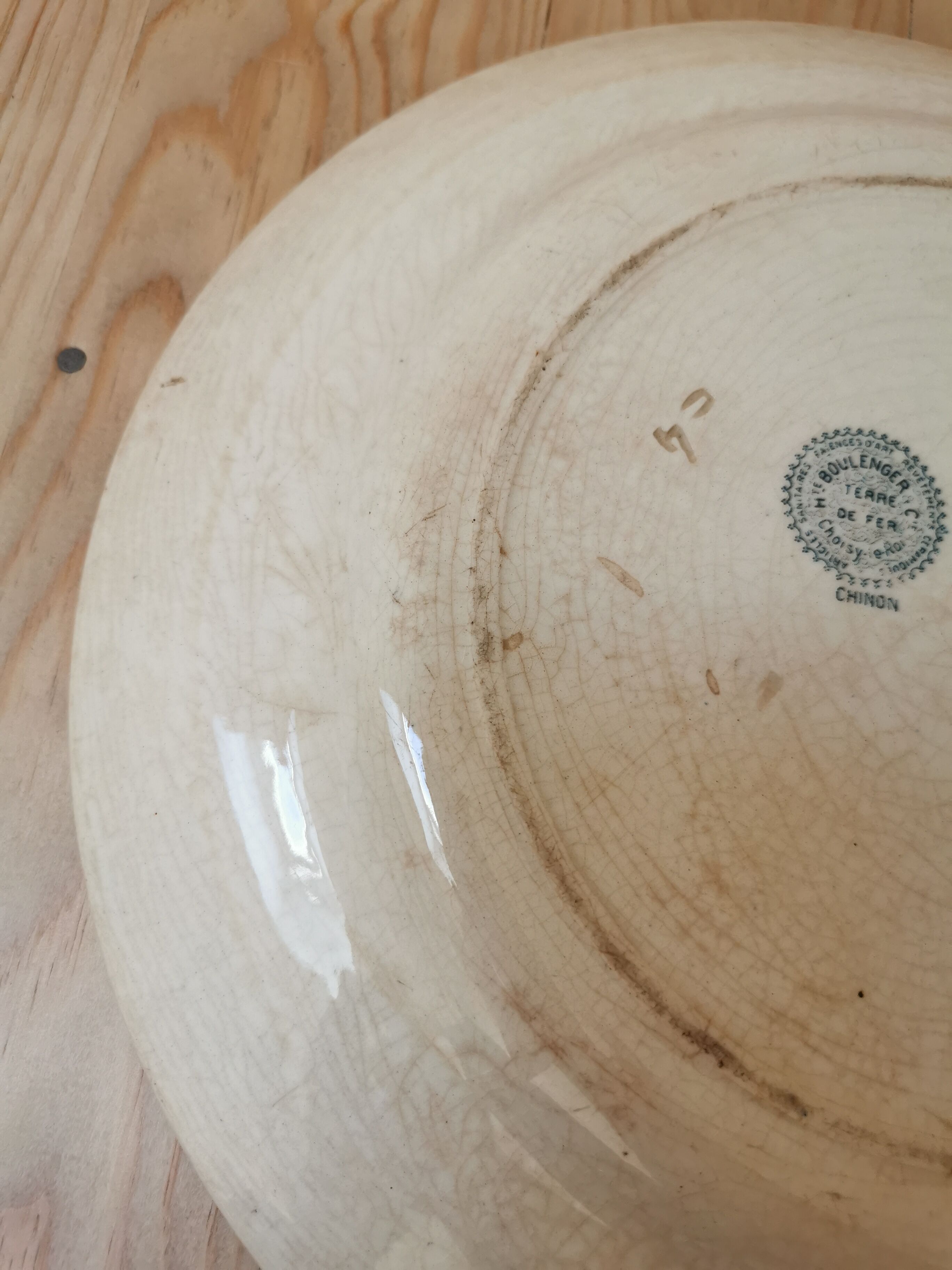 Large old round plate in iron earth