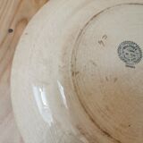 Large old round plate in iron earth