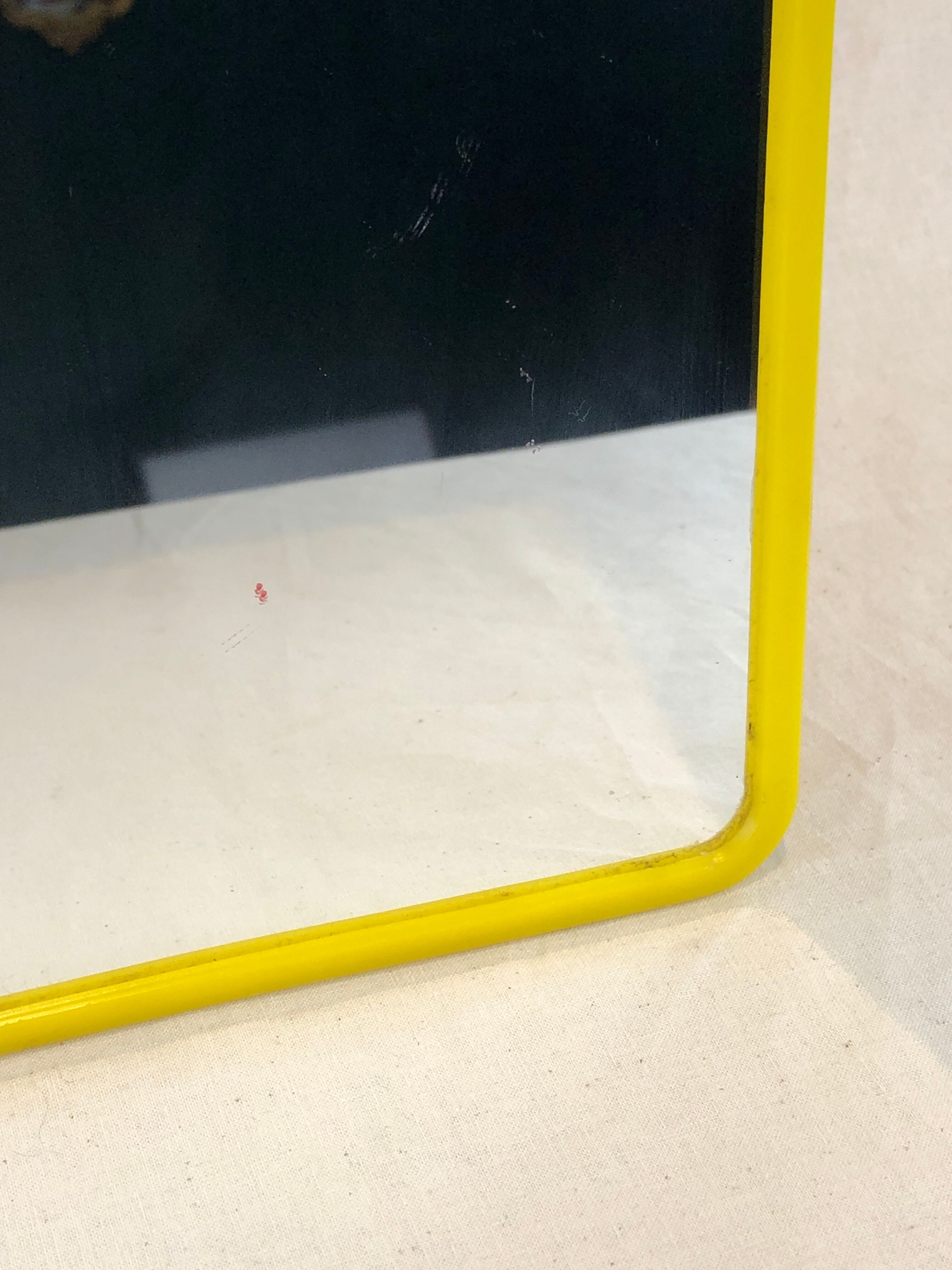 1970s mirror yellow plastic frame