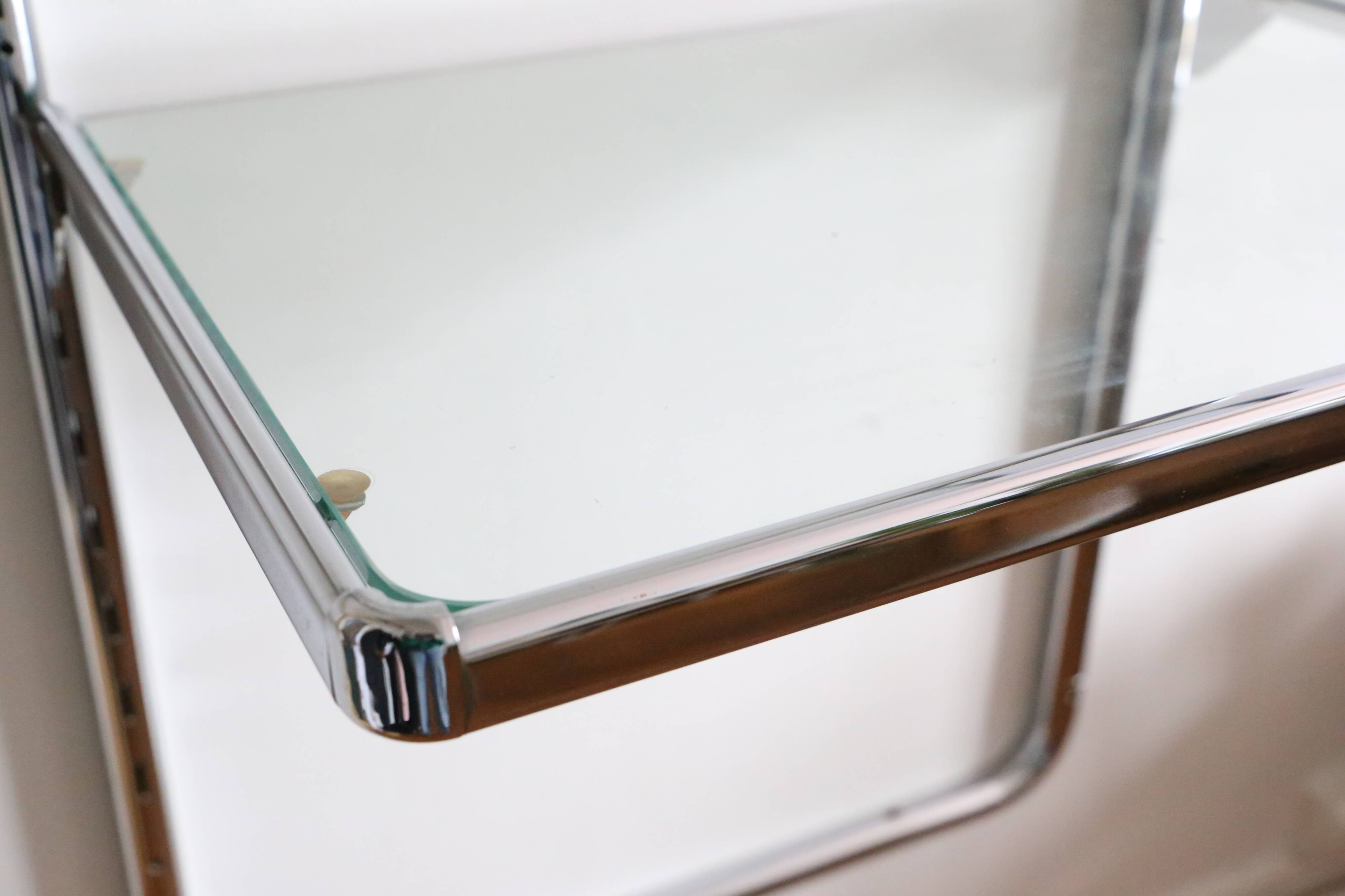 Chrome and glass wall shelf, circa 1960