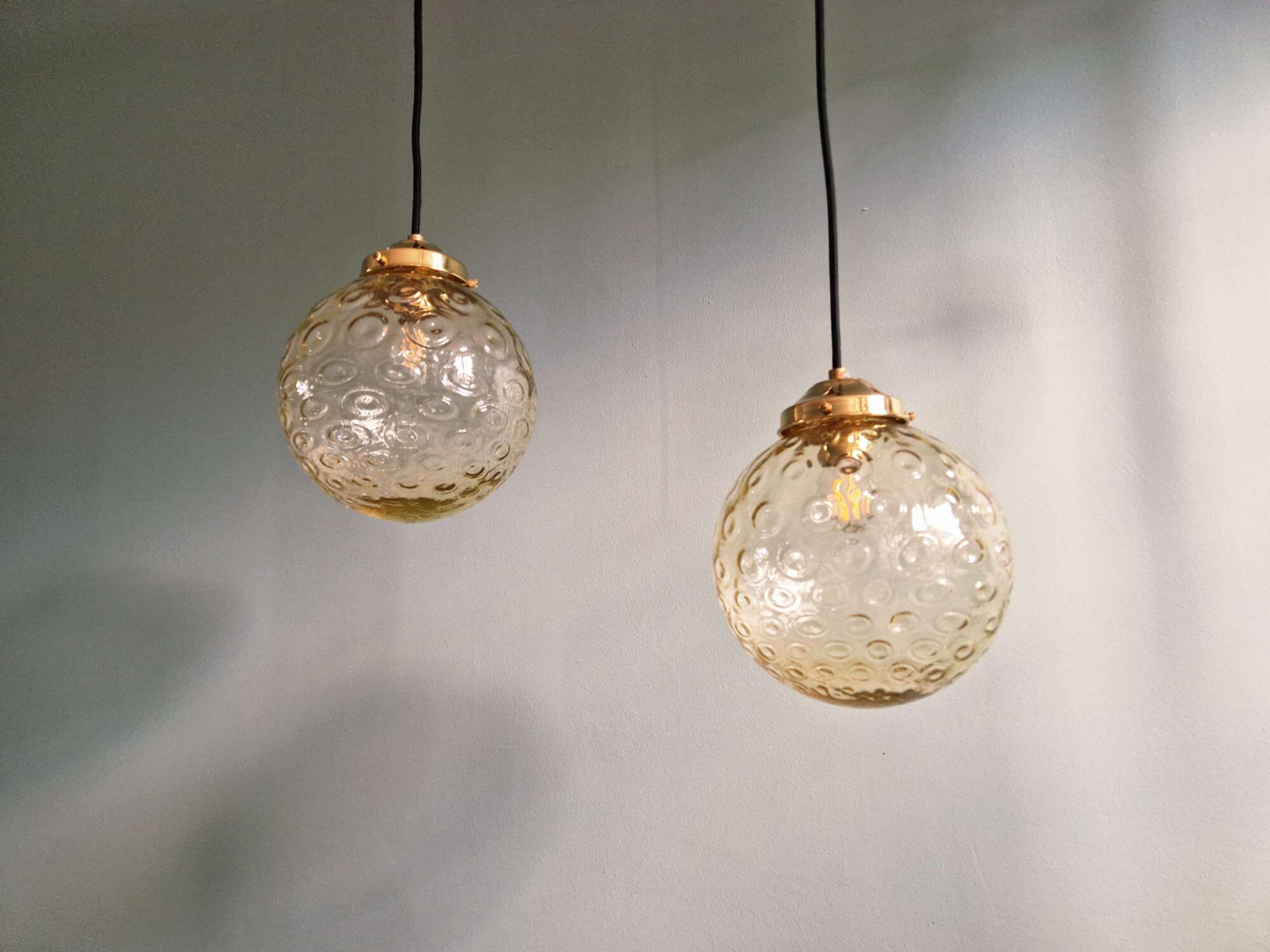 Pair of amber bubble glass pendant lights, 1970s
