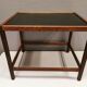 Smaller lamp/Side table of rosewood with black formica tabletop, designed by Kurt Østervig.