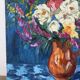 Bouquet on a blue background, oil on canvas signed Gisèle Renaut.