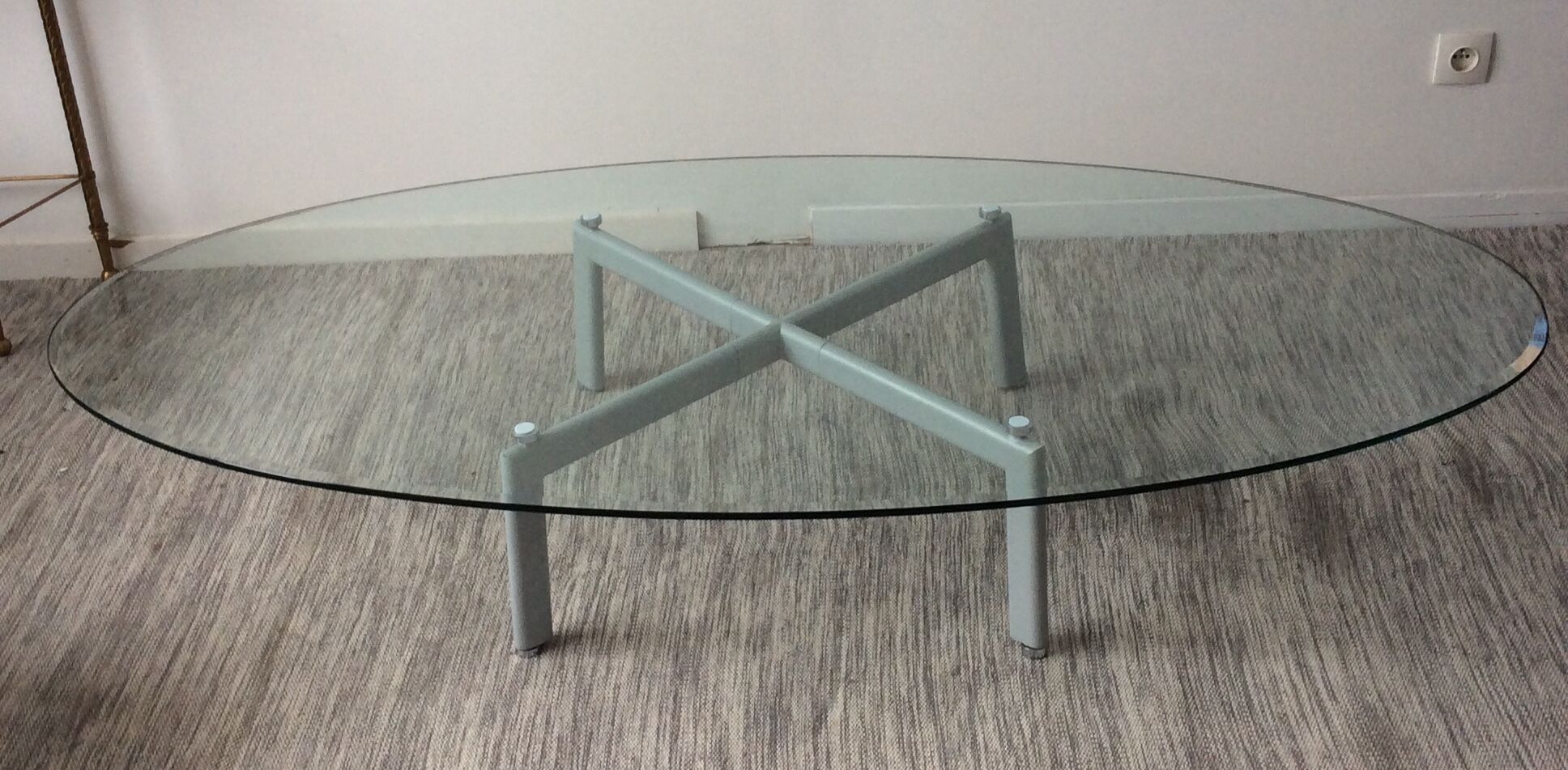 Design coffee table in beveled glass and steel foot