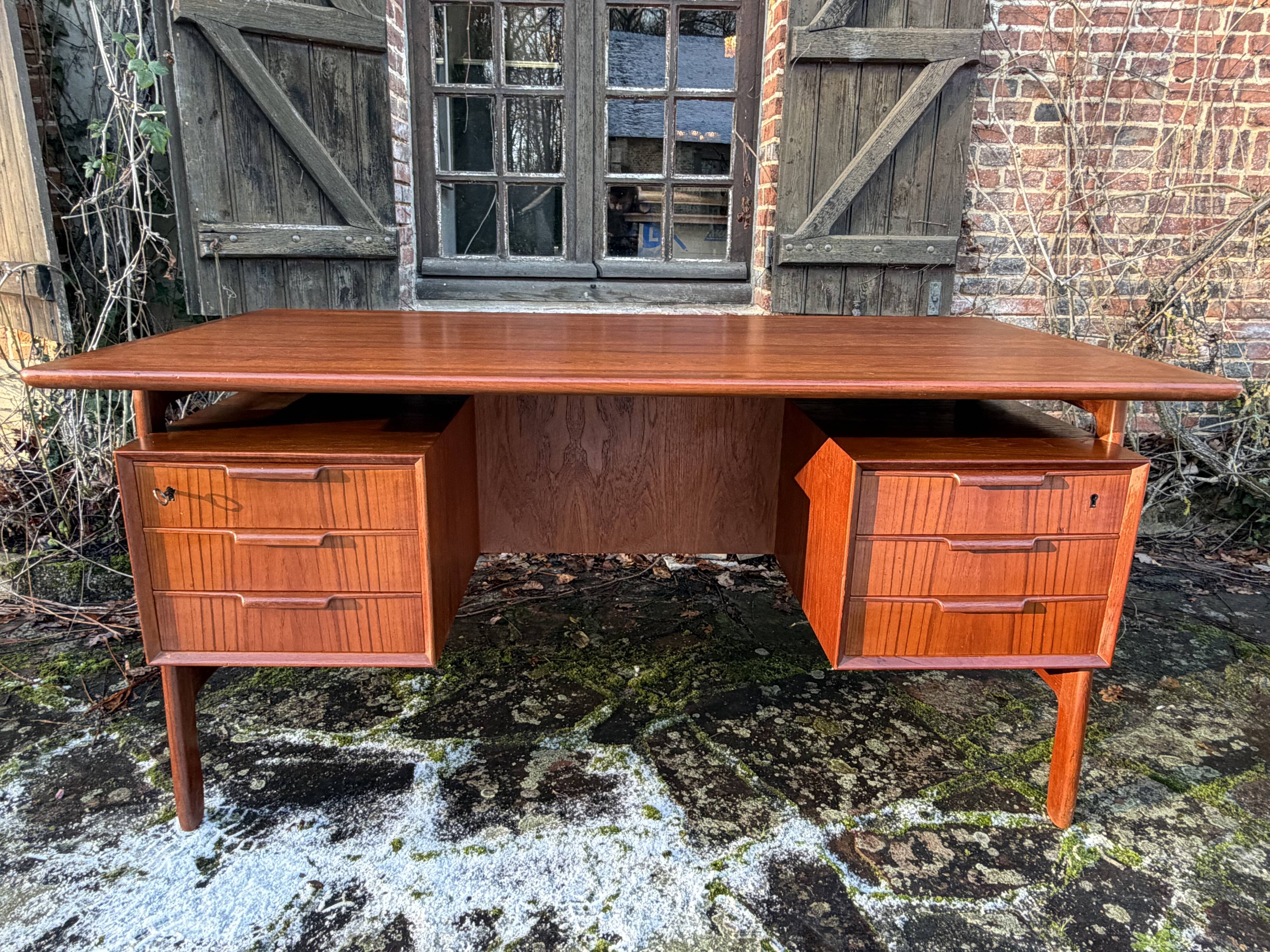 Danish teak desk Gunni Omann no. 75 from the 1960s.