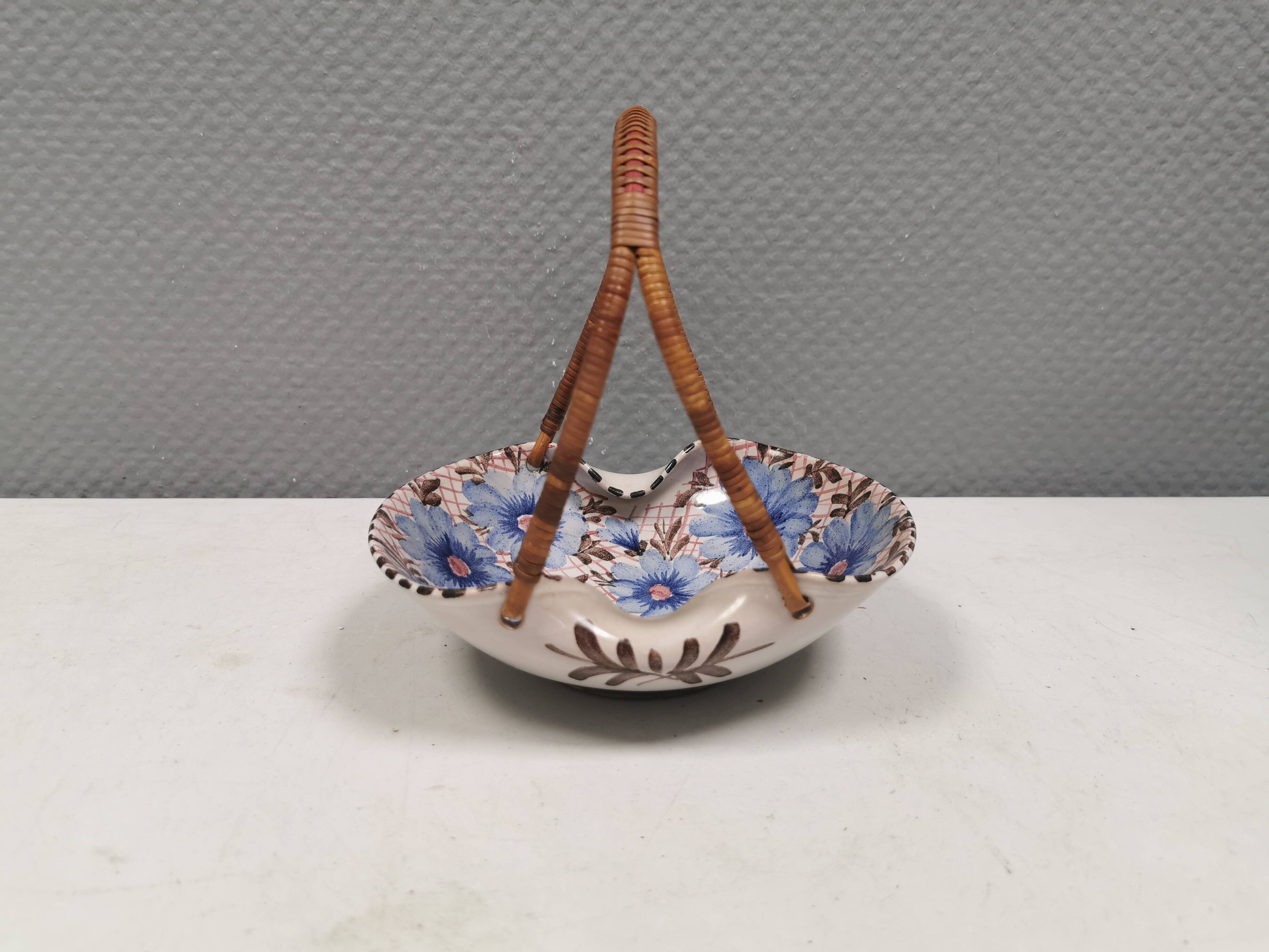 Beautiful small painted ceramic basket with woven handle