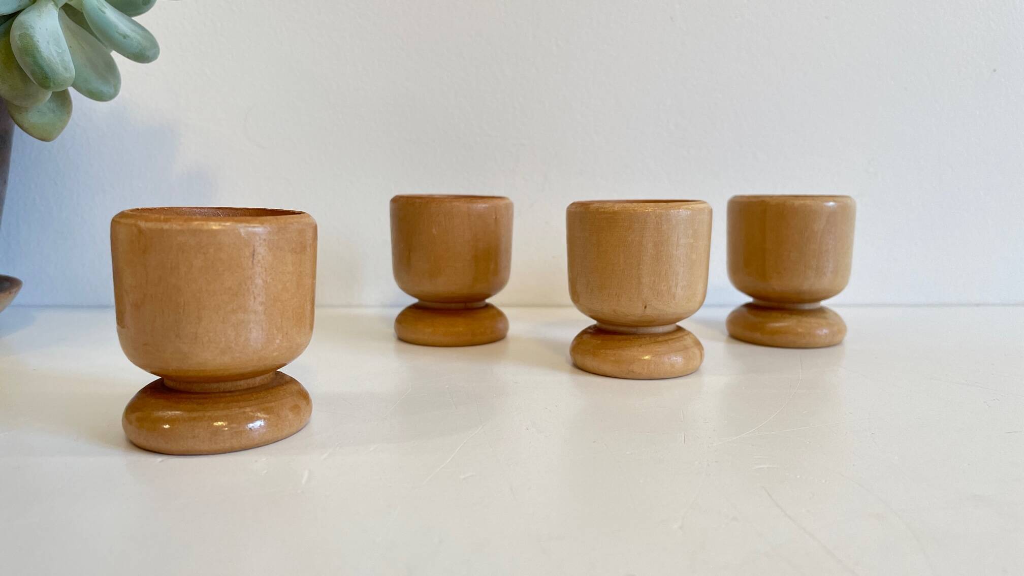 4 vintage turned wooden egg cups