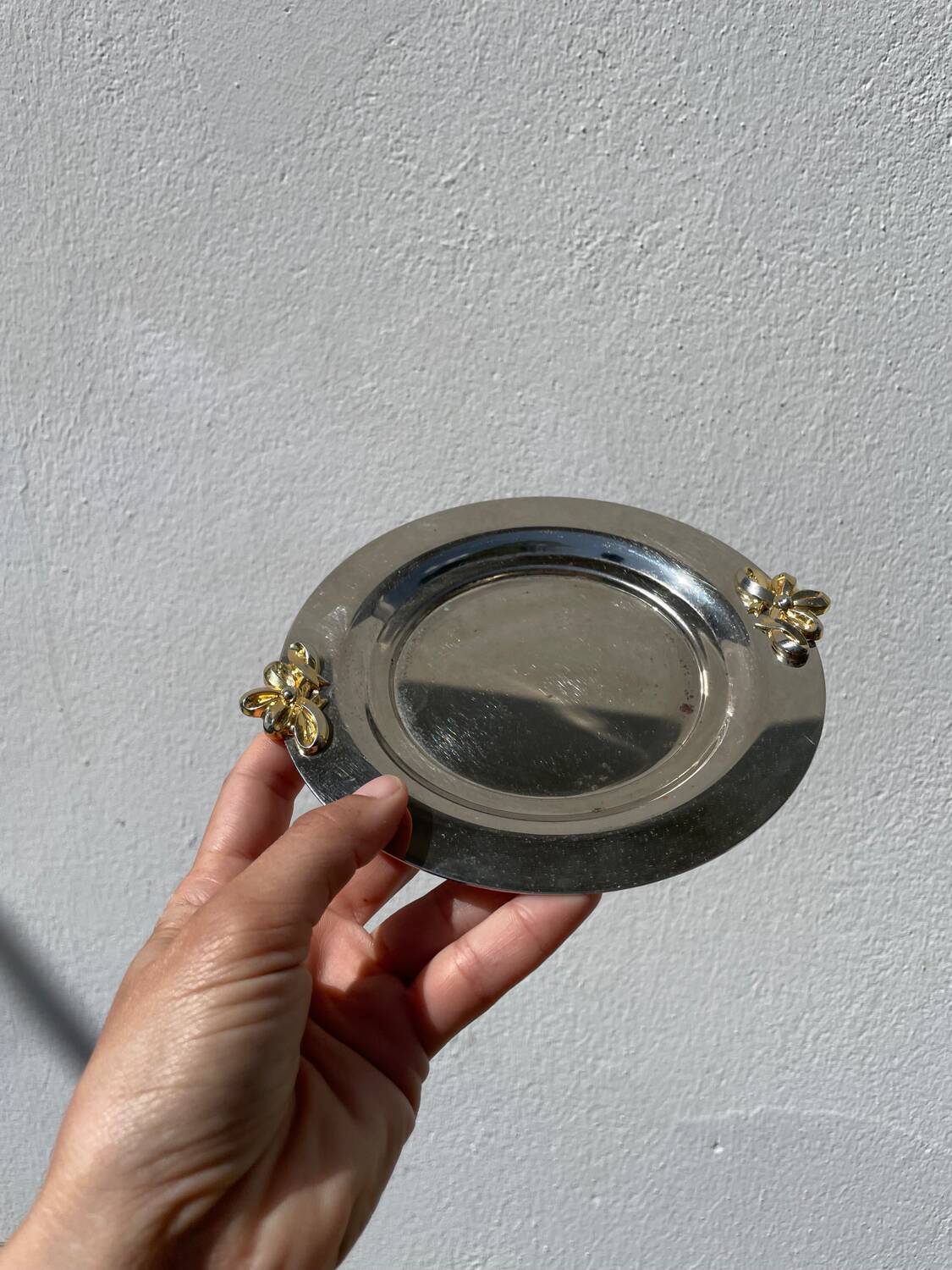 Silver-plated metal butter dish with knots