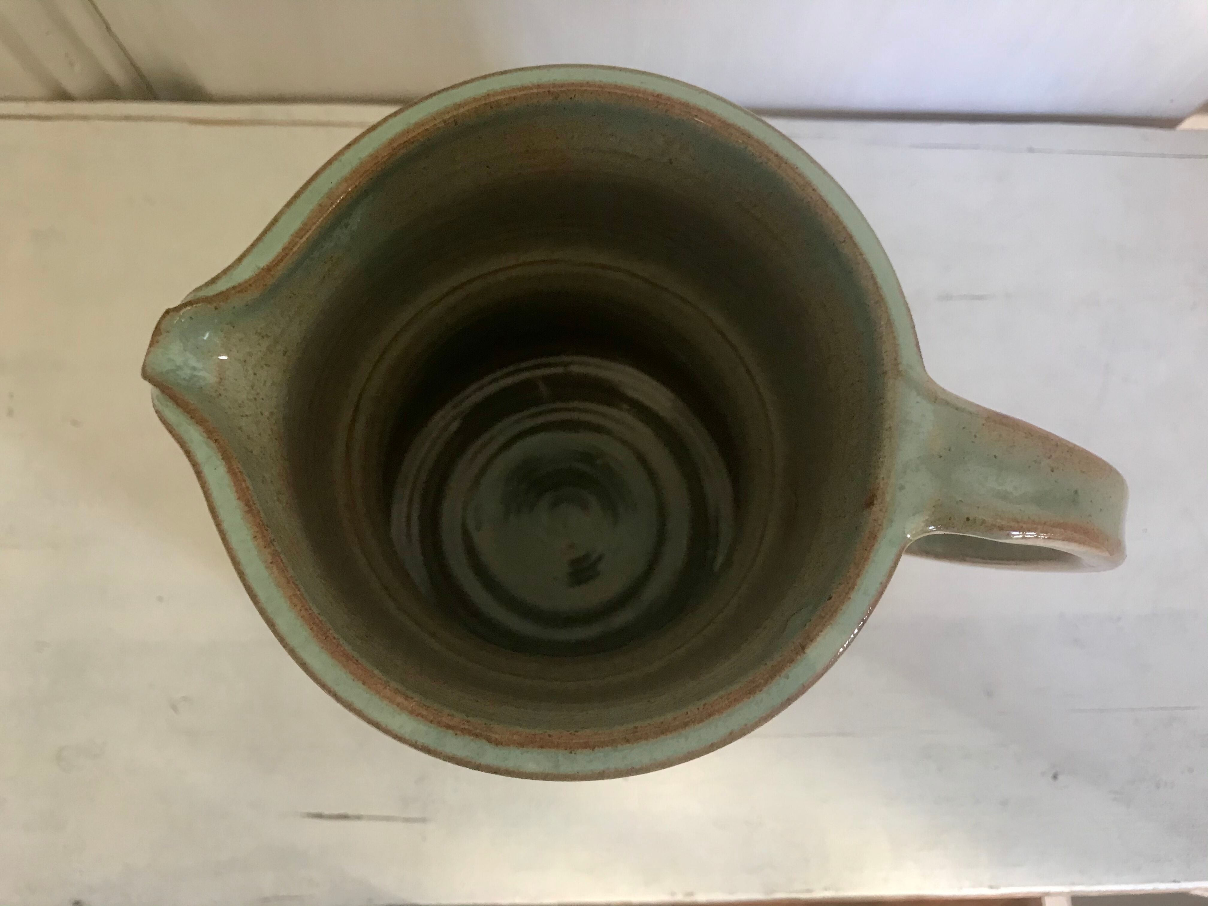 Pitcher and its vintage sandstone glasses