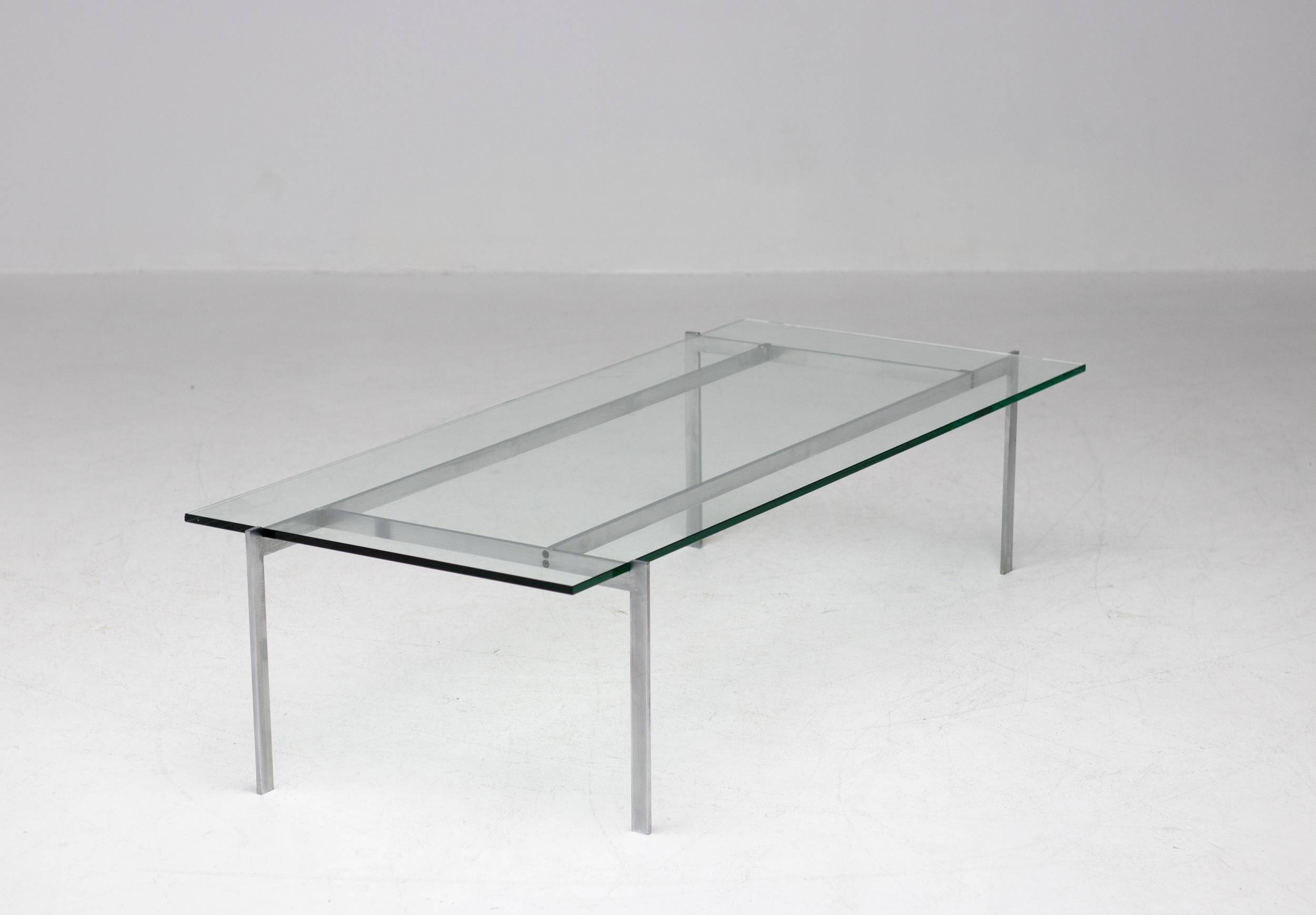 Architectural rectangular coffee table in steel and glass.
