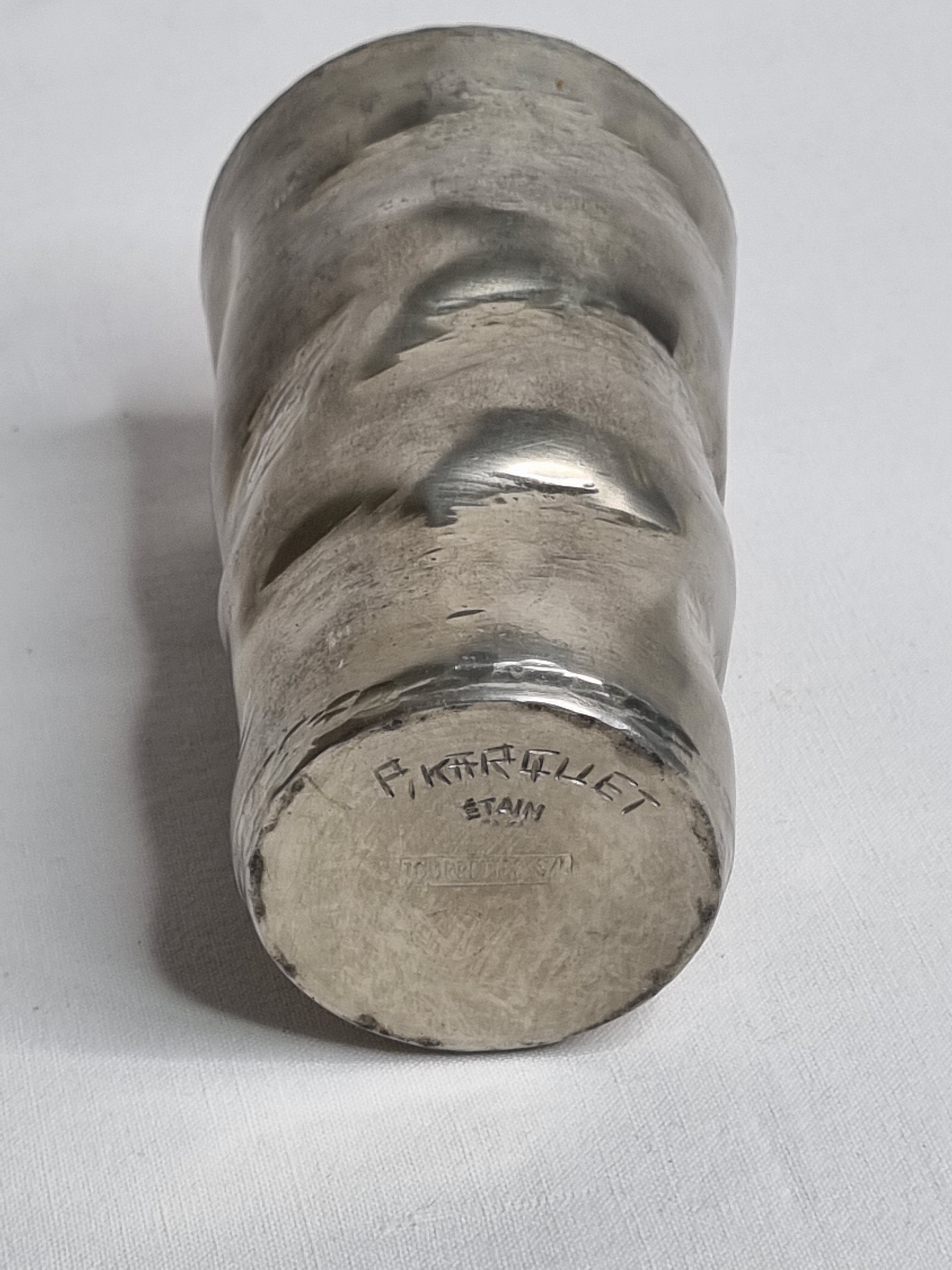 Hammered tin cup, signed