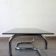 Table basse chrome et verre fumé space age 70's