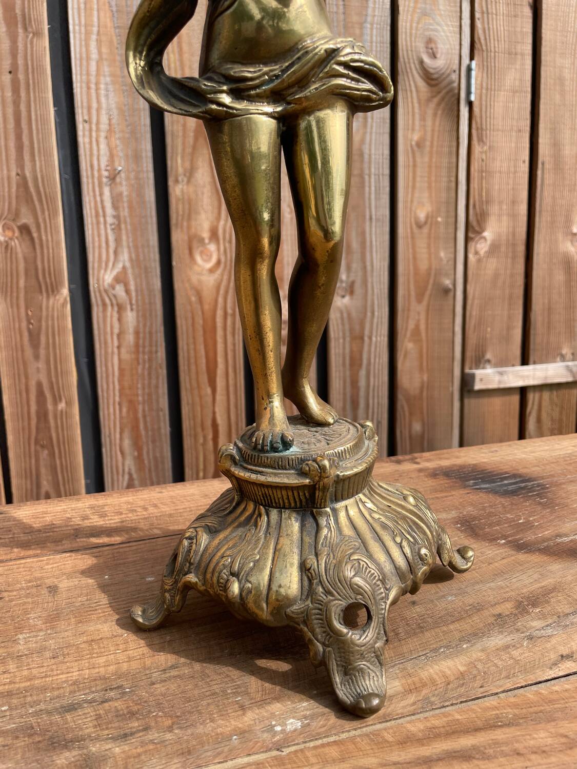 Large bronze candle holder with putti angel