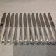 12 silver-plated table knives by Ercuis Valencay, 25cm