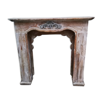 Patinated wooden fireplace